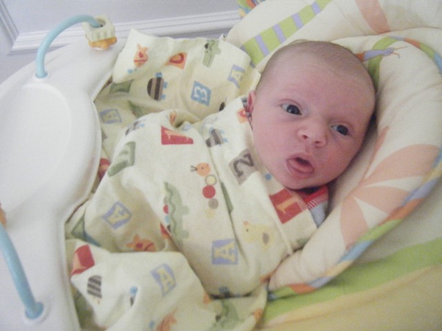 Andy loves his new swing from Kathryn and Pat
