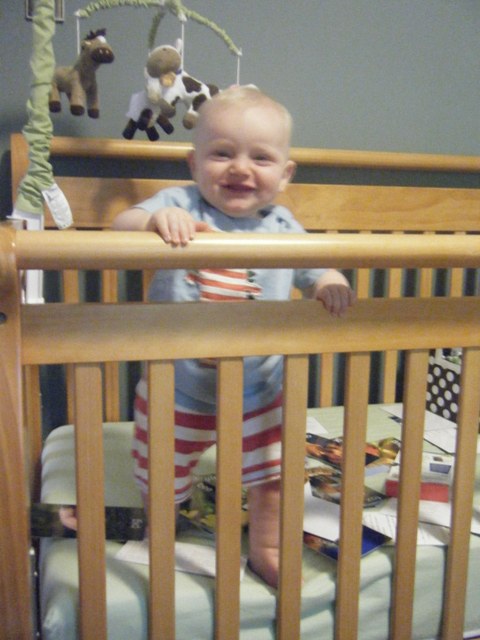 Andy stood up by himself in his crib for the first time!