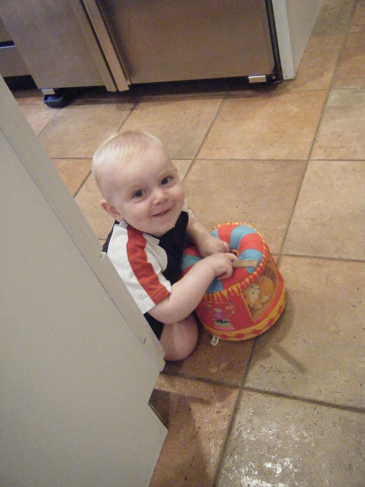 In birthday outfit from GPW playing with birthday circus toy from Lorget Family