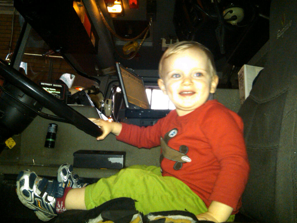 Andy sitting in fire truck at DC fire station
