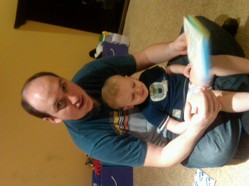 Andy in jeffs lap reading book