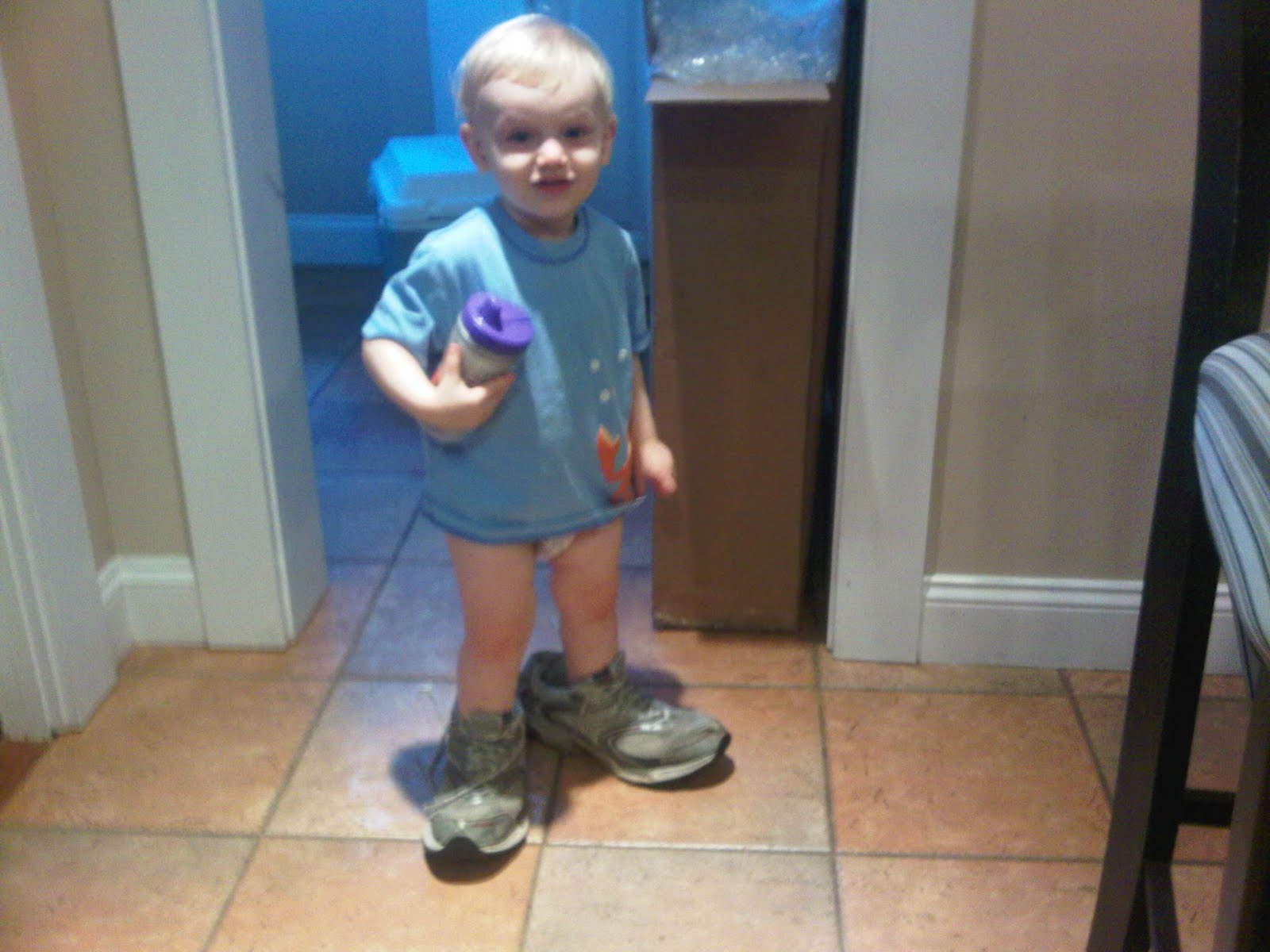"Andy wearing Daddy's shoes"