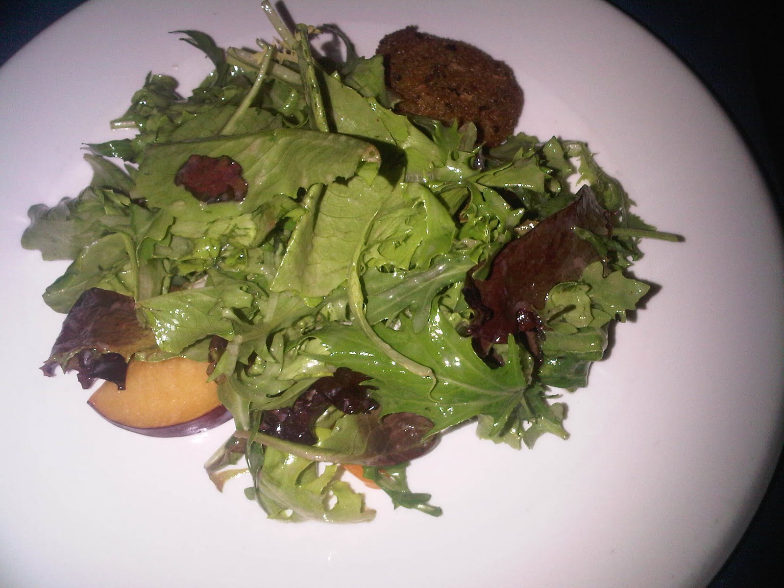 Manchego encrusted with herbs, stone fruit, toasted almonds and lemon vinegrette salad