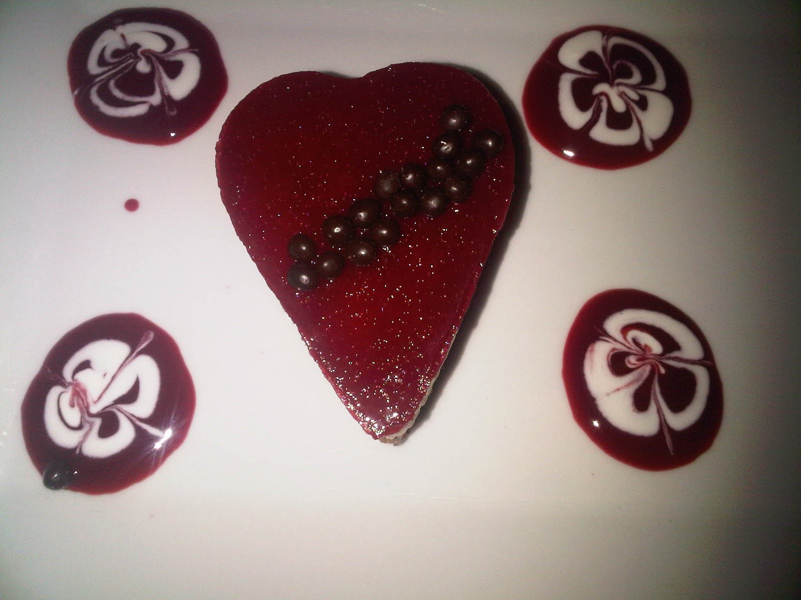 White chocolate and dark chocolate mousse topped with raspberry gallette