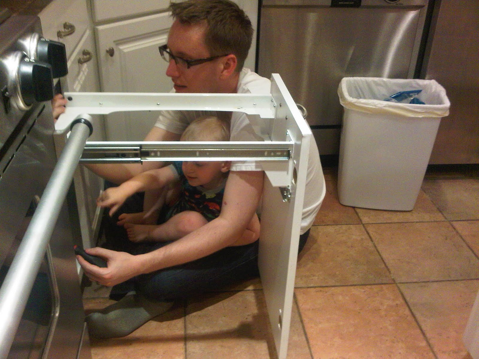 Andy helping Matt fix the trashcan