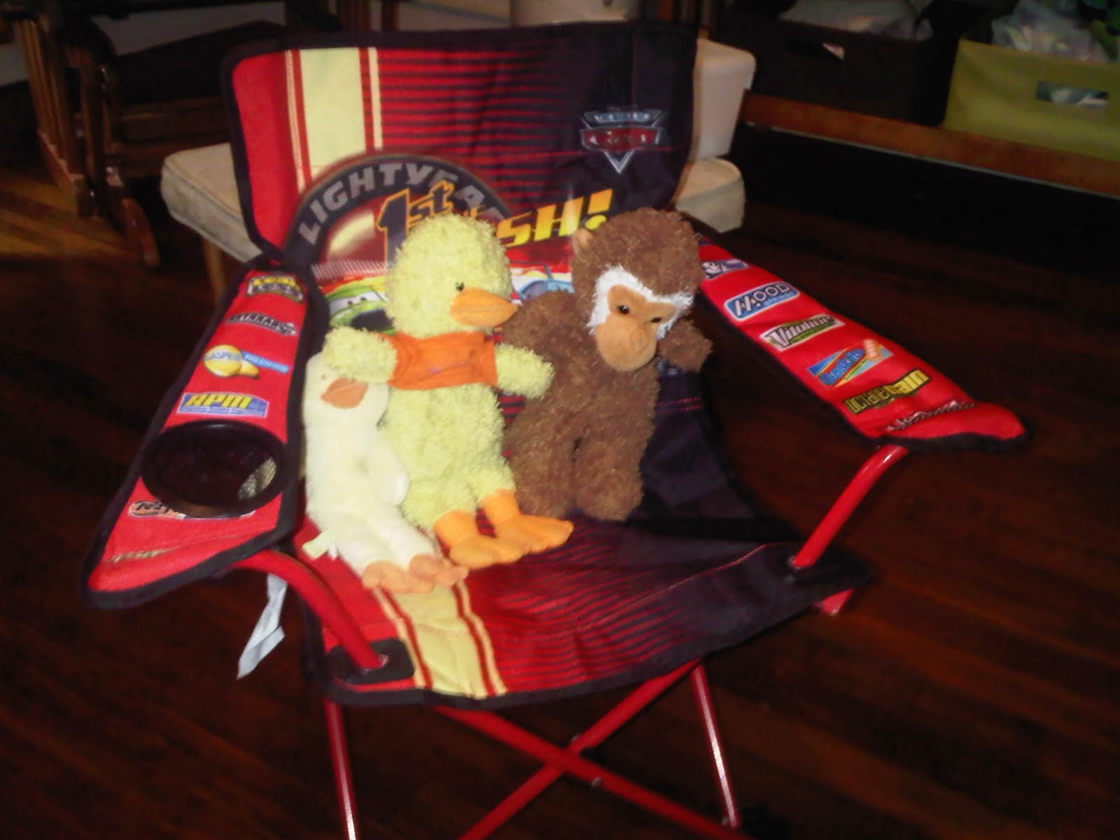 Ducky monkey and tiny duck watch Andy play with legos