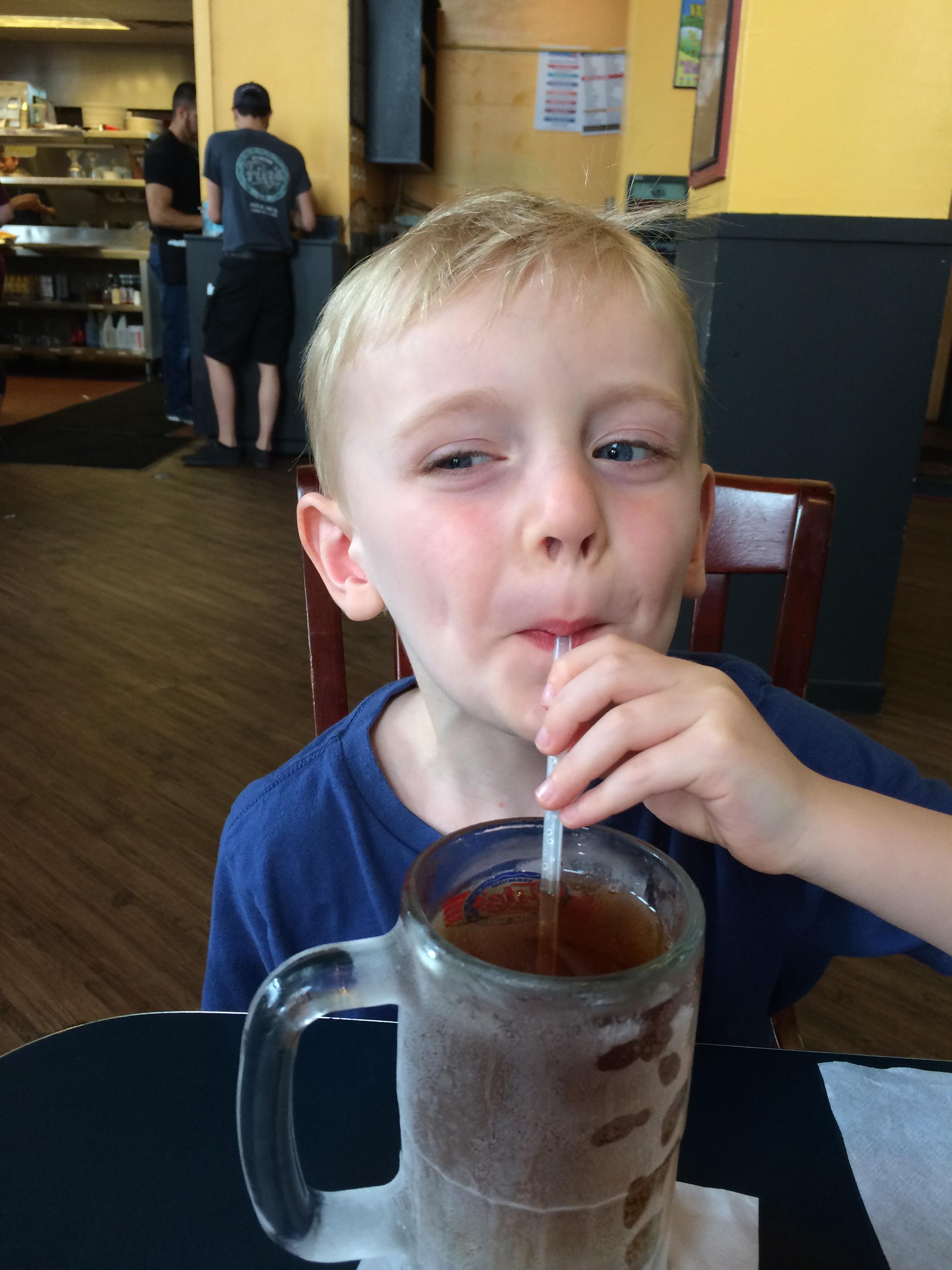 Celebrating a wonderful swim lesson with a cold root beer at fitzs with daddy
