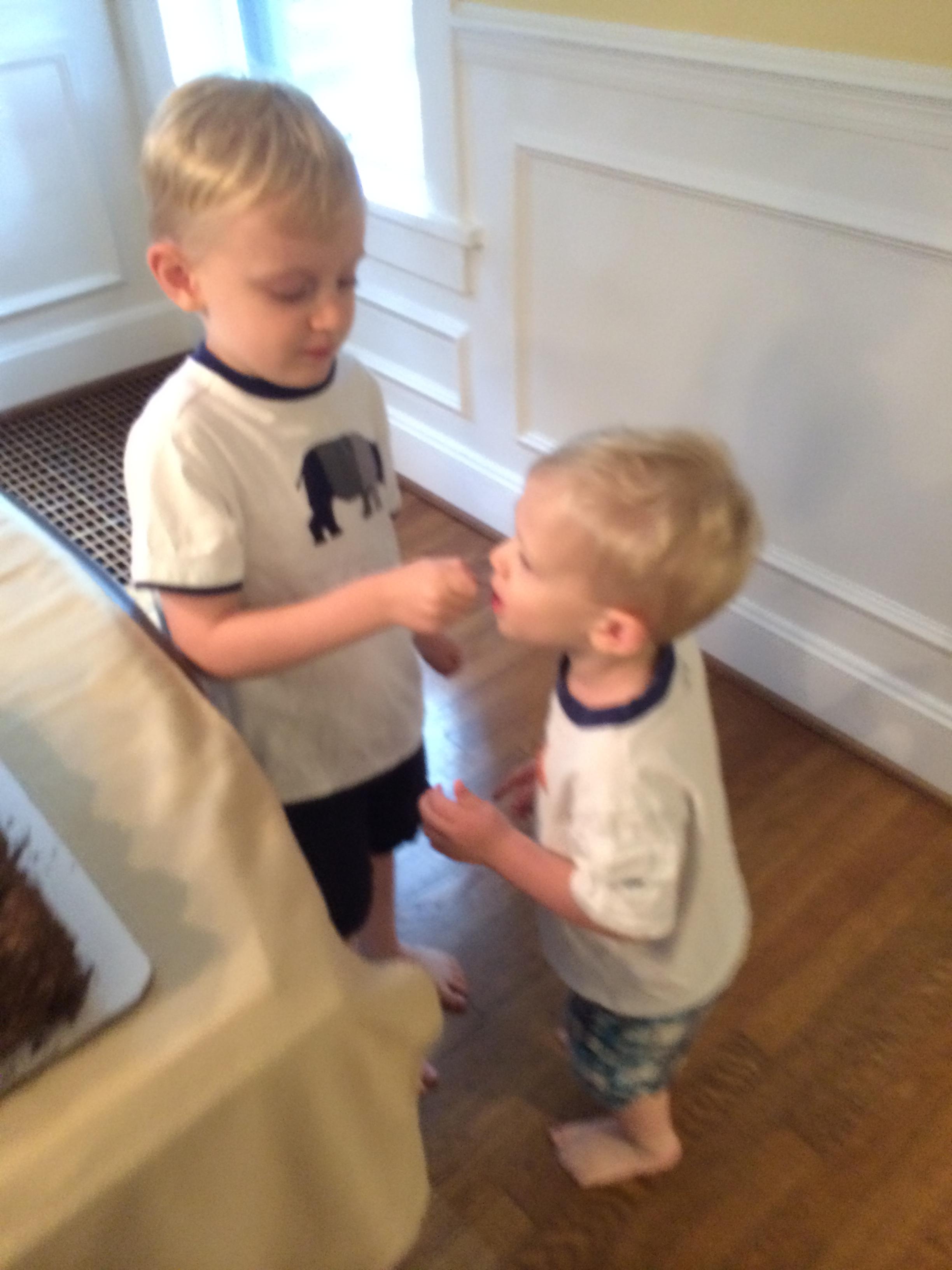 Feeding Charlie a cherry off the cake