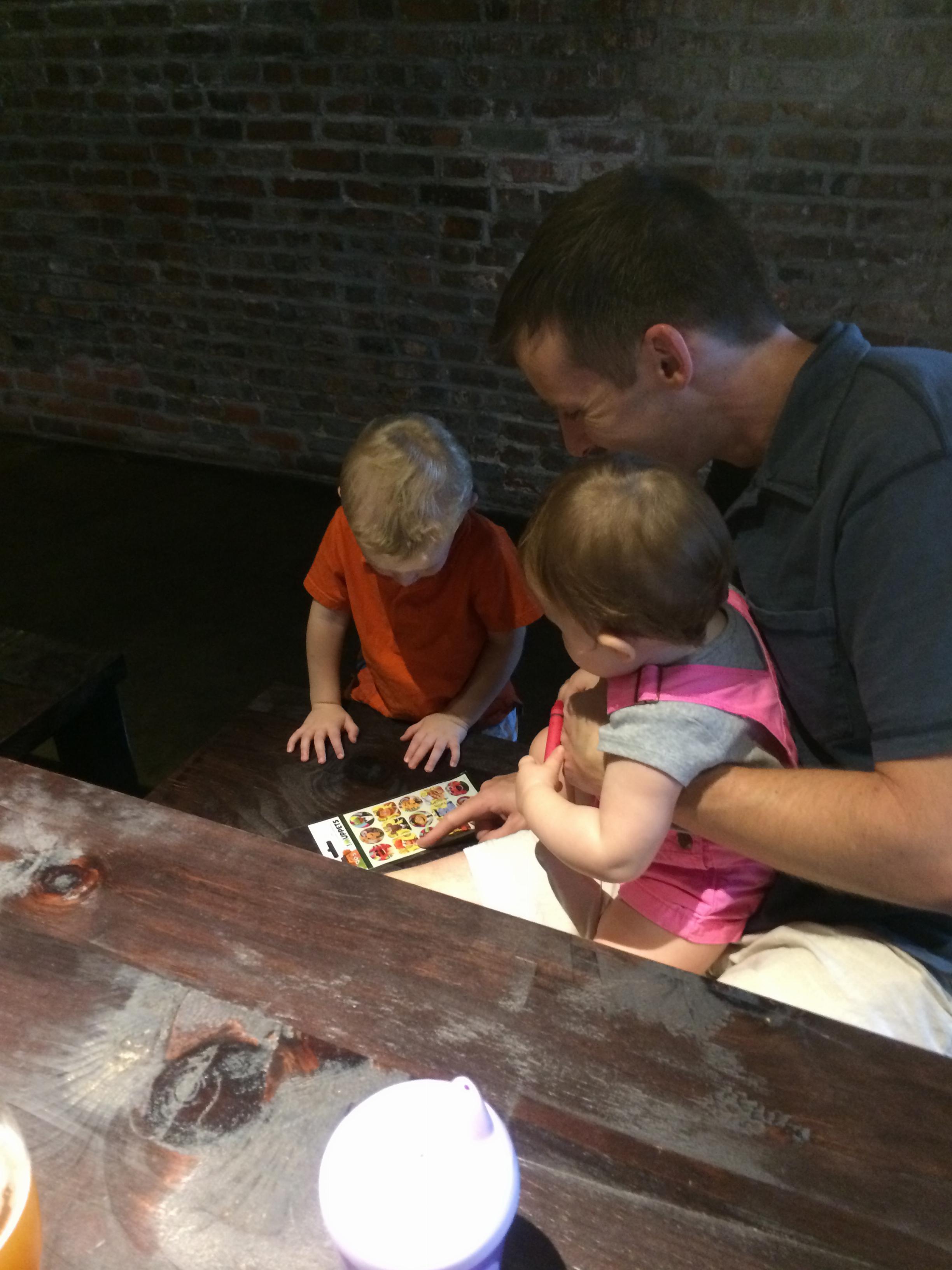 Charlie giving Saigey stickers at urban chestnut