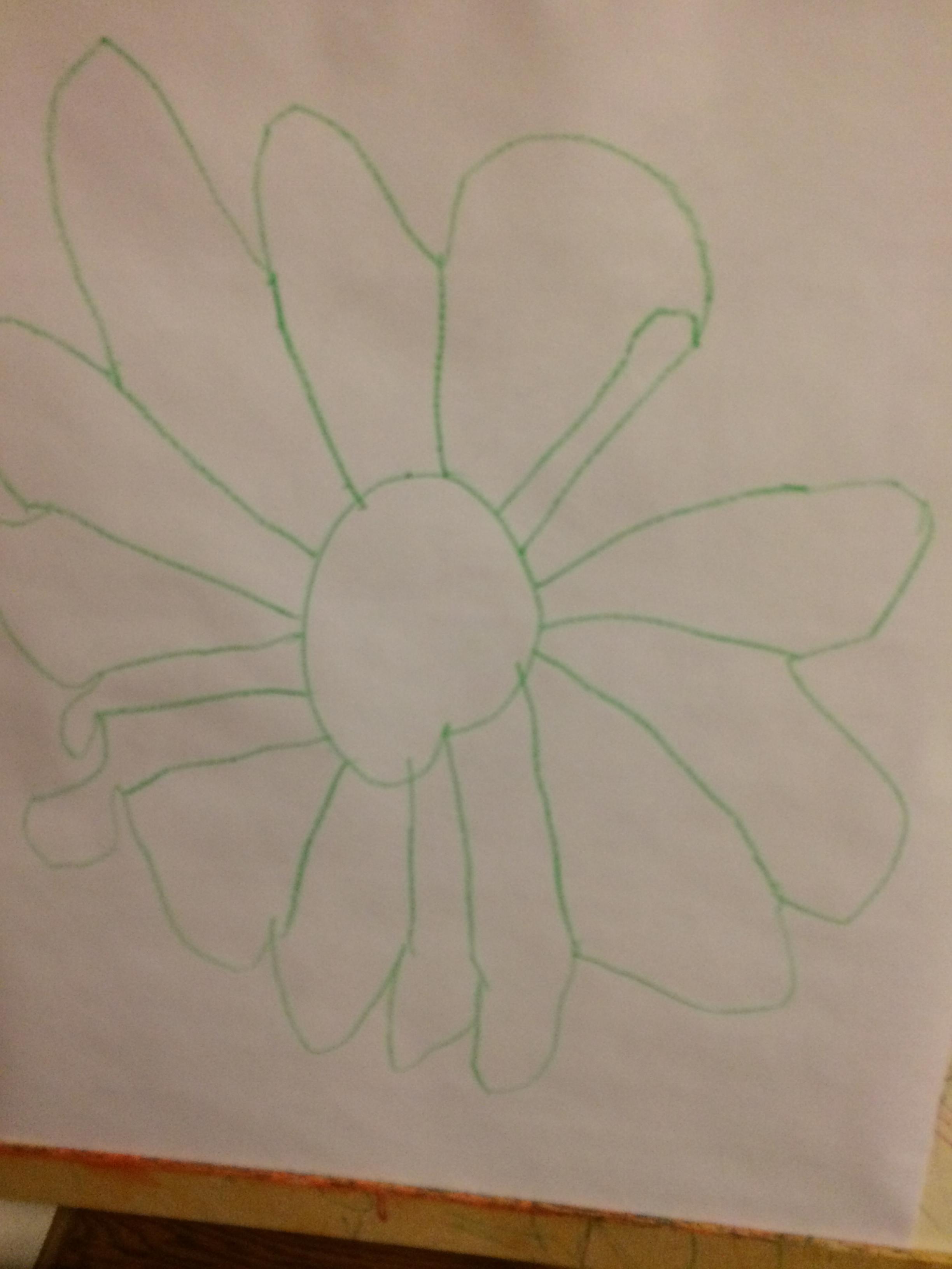Andy made a flower for Charlie to color in so he could learn to color in the lines
