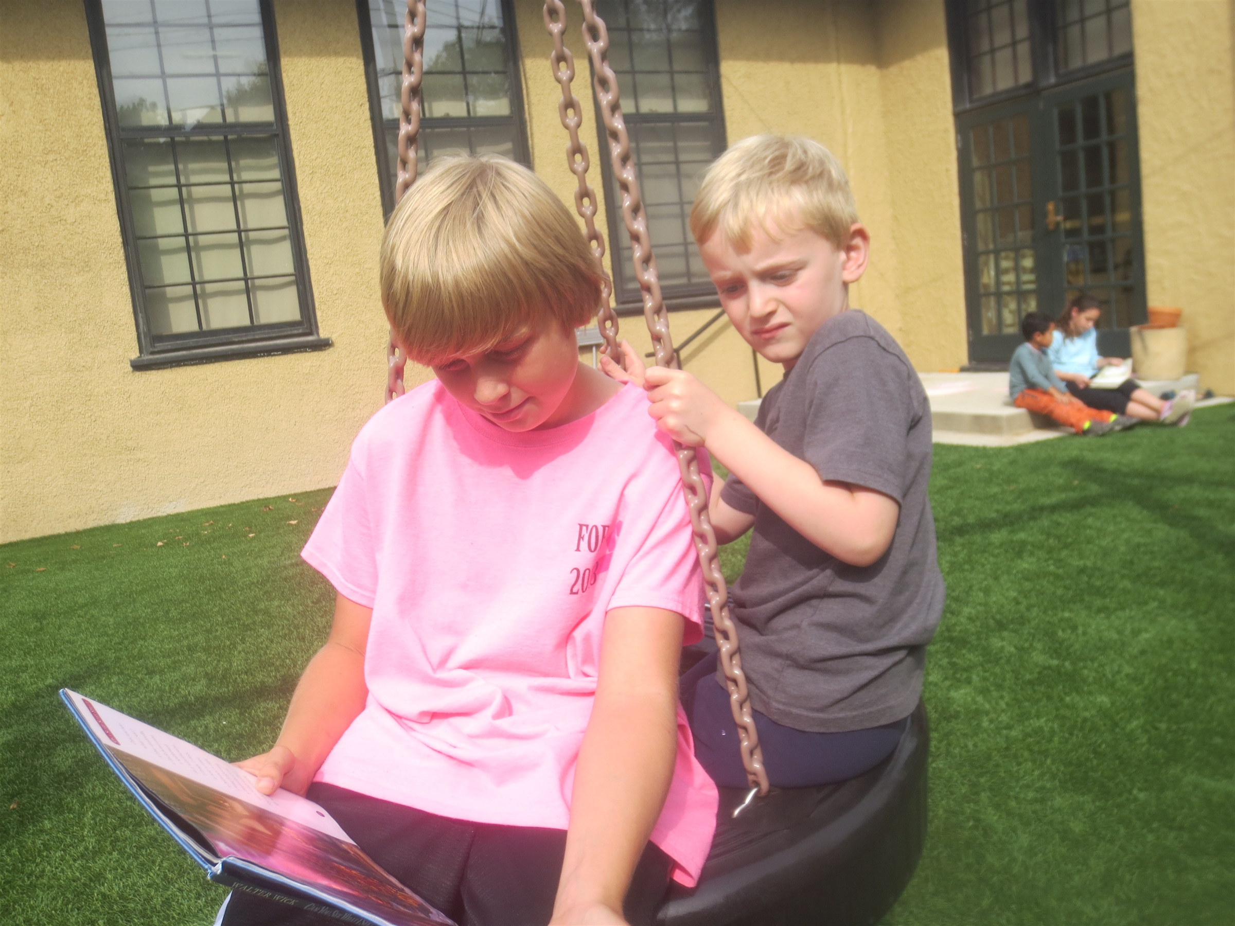 outside reading with 6th grade buddies: Andy and Reid