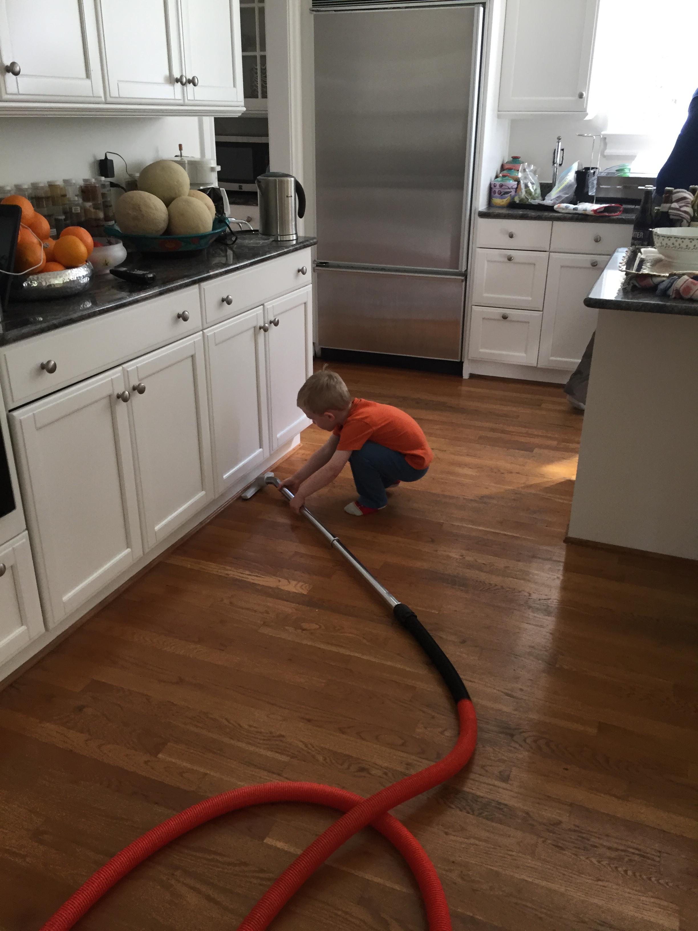 Charlie vacuuming before the Seder