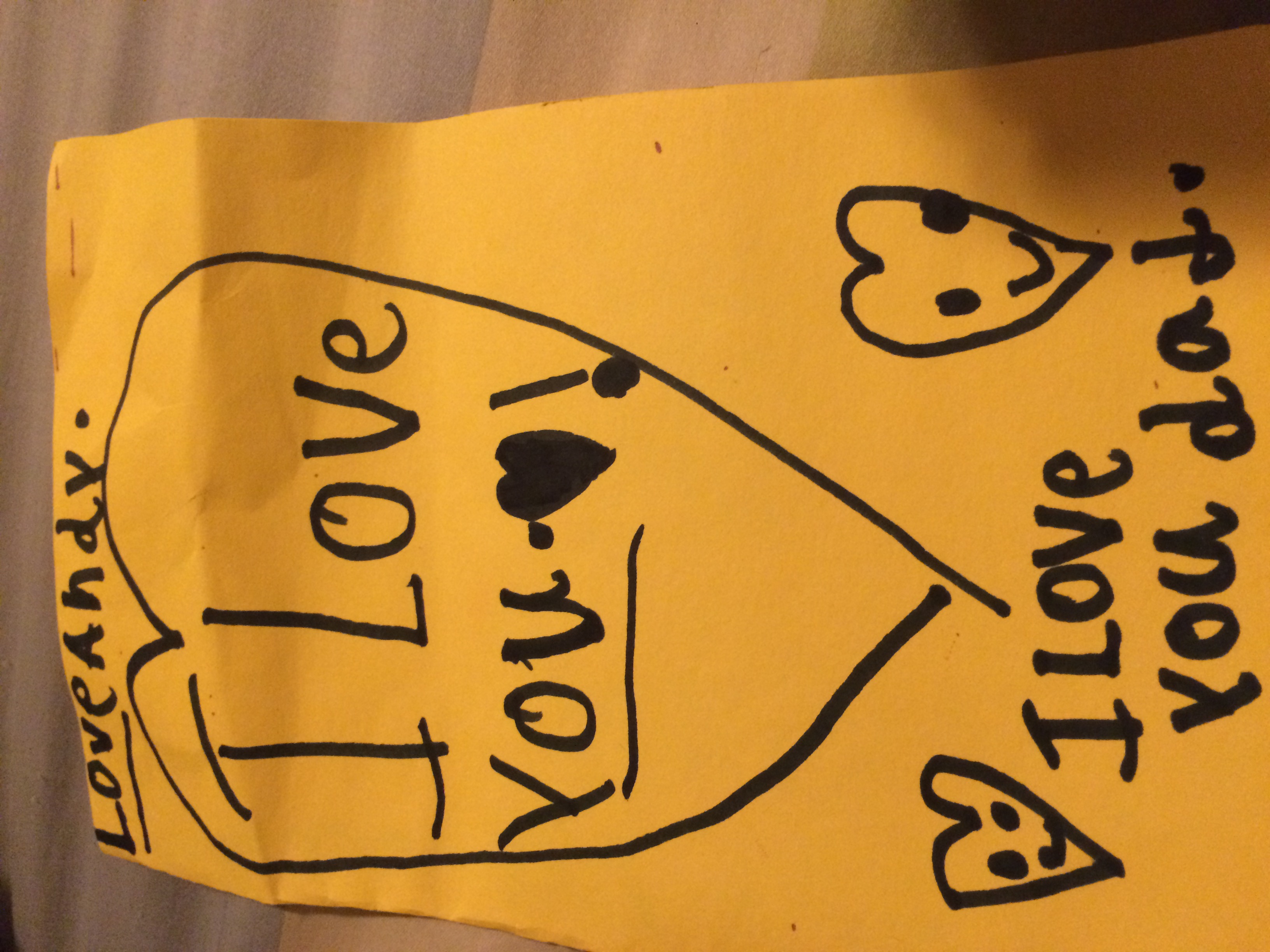 Andy made dad a card in camp.