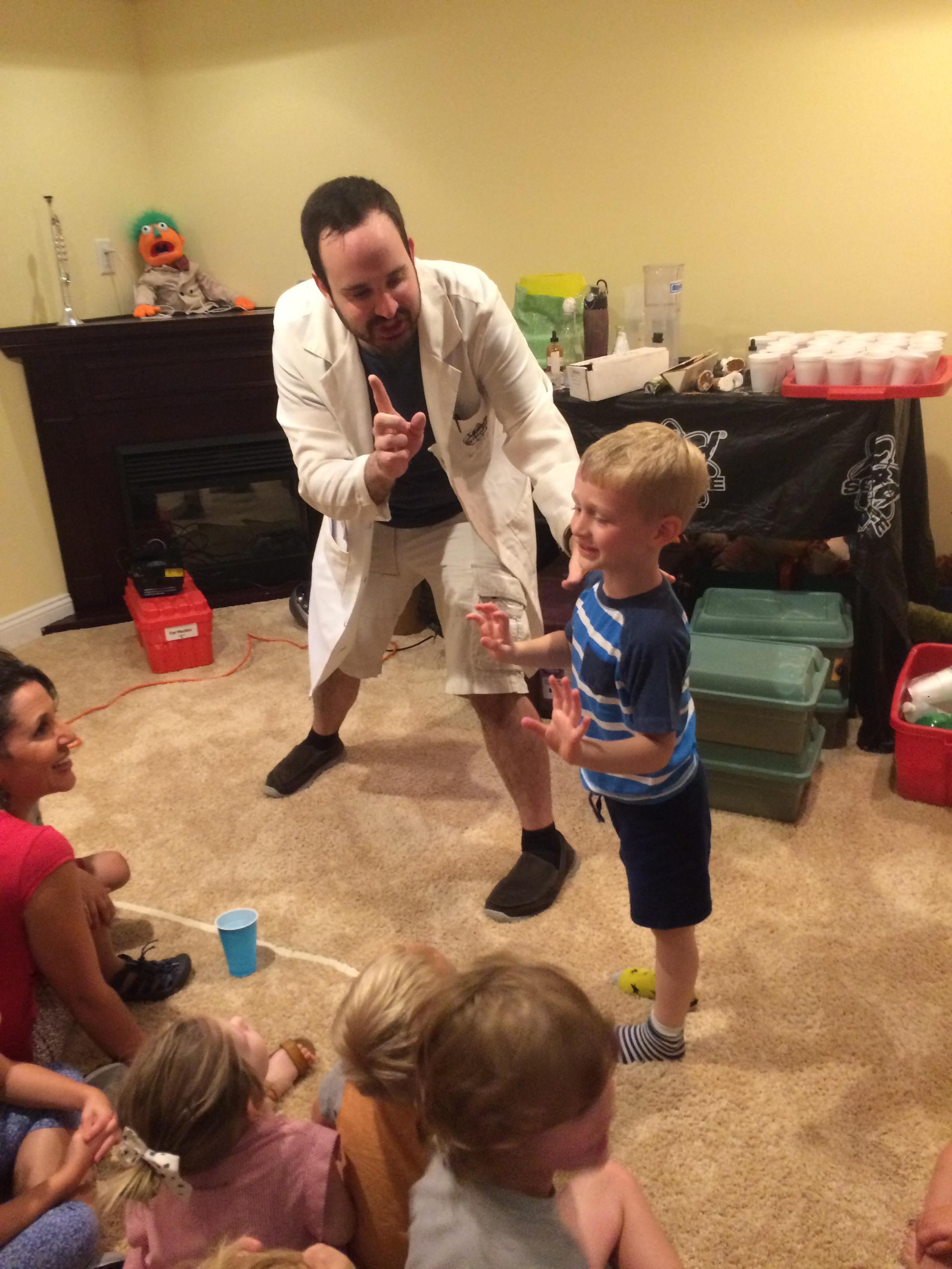 Kinetic Kevin told the kids to yell happy birthday Charlie. Charlie told the kids to settle down