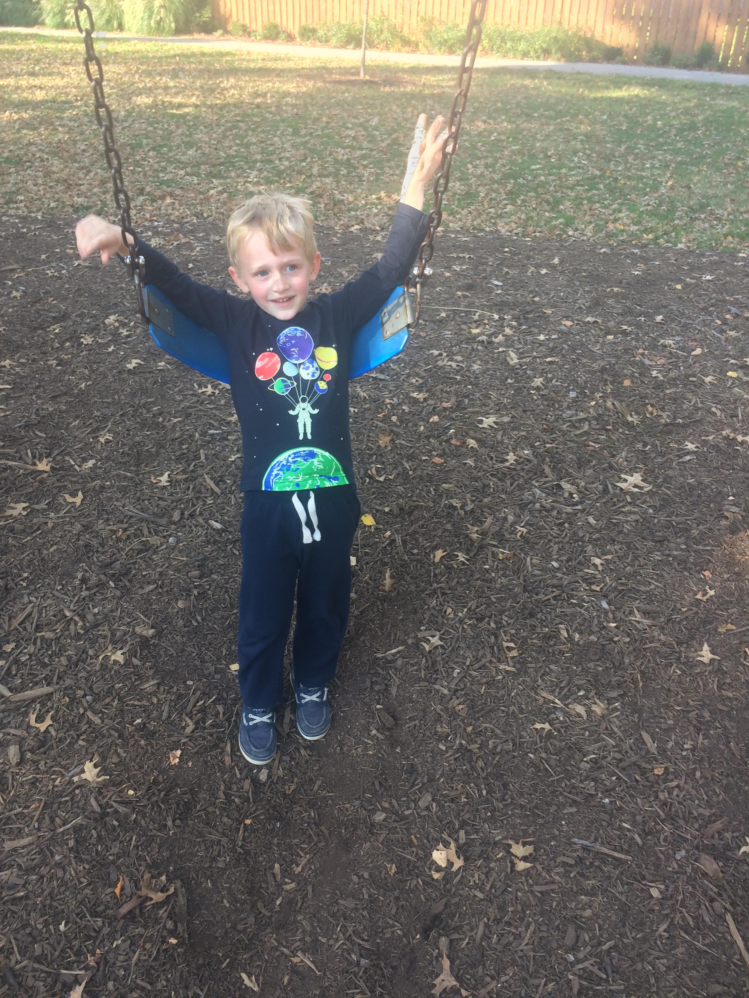 Swings in new shirt from Momo and baba