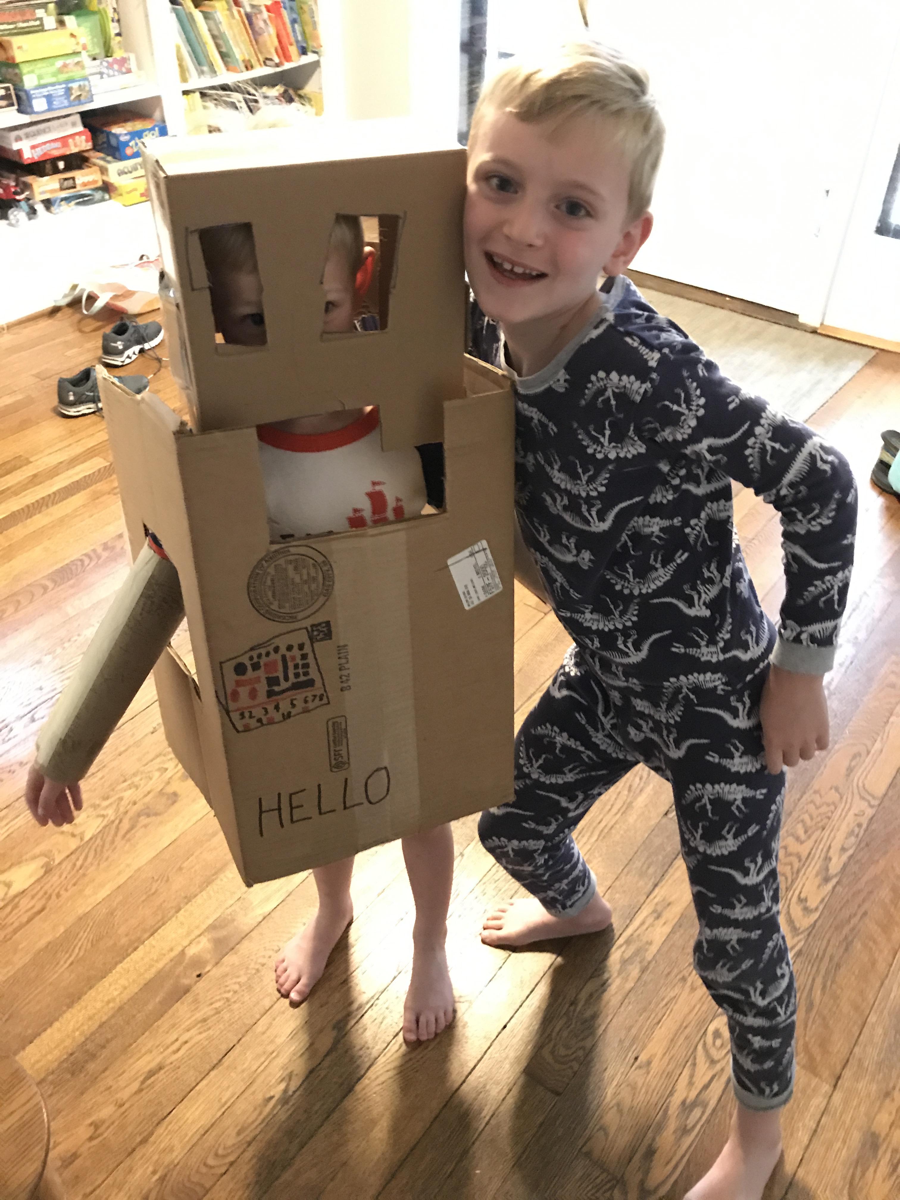 Charlie wearing robot Andy made in camp